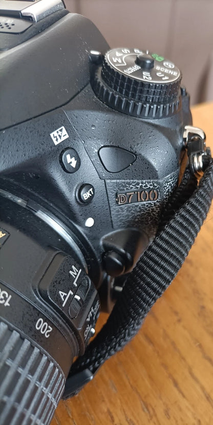 NIKON D7100 CAMERA WITH DX AF-5NIKOR 55-200 LENS.